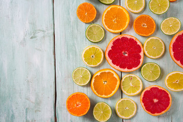 citrus fruit slices on turquoise background