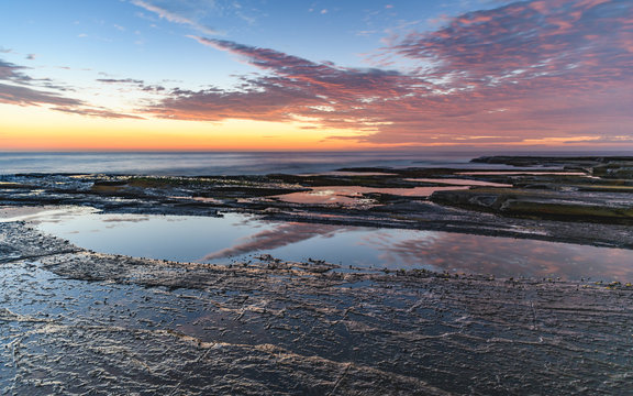 Dawn Seascape and Reflections on the Rock Platform