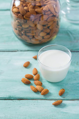 almond milk on turquoise surface