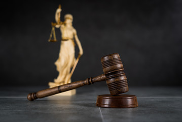 Law and Justice concept. Gray stone background, reflections on the floor, place for typography....