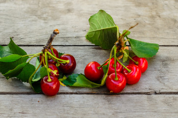 Fresh ripe cherries on wooden table