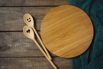 round cutting board and smiling spoon