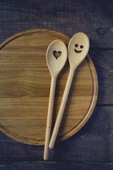 round cutting board and smiling spoon