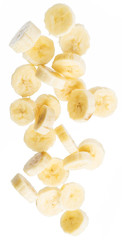 Peeled banana slices are falling down. Vertical picture.