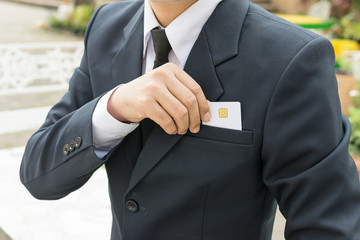 Businessman holding a credit card