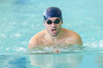 Plakat male swimmer in action