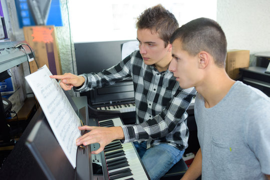 young men with an electric piano