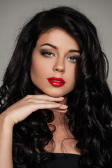 Fototapeta premium Attractive Female Model with Makeup and Curly Hair