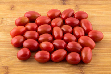 Cherry tomato on wooden board 