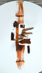 Dessert - Chocolate puff cake decorated with chocolate pieces. Both gutted cocoa and powder. White chocolate.