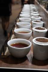  Row of Cups of tea, various kinds of tea
