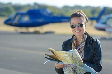 woman holding a map at the front of a chopper