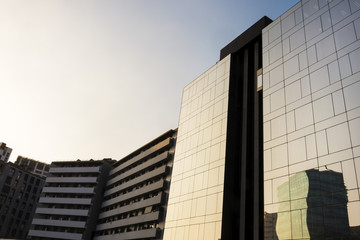 Obraz premium background of concrete and glass buildings