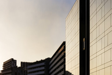 Obraz premium background of concrete and glass buildings
