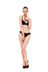 Fototapeta premium Sexy girl in black lingerie on white