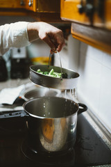 Man of 59 year old working in the kitchen of his house.