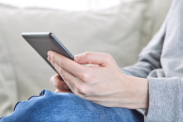 Man reading an e-book on digital tablet device