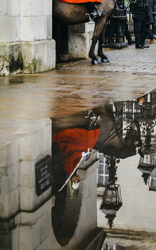 Reflection of mounted British guard on horse at Horse Guards parade ground on Whitehall, a major London tourist attraction.