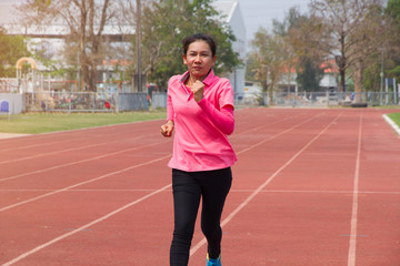 Obraz premium Asian lady run in track