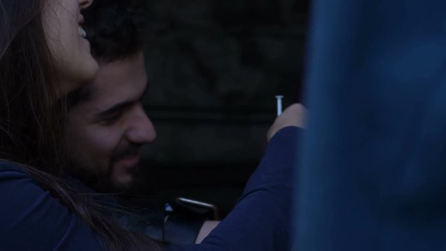 heroin addicted couple injecting drugs smiling