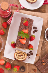 Chocolate roll with strawberries. 