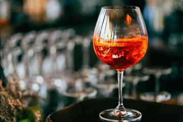 Glass of Orange Sangria Cocktail in the Bar with Amazing Blurred Background, Free Space for Text