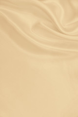 Smooth elegant golden silk or satin luxury cloth texture as wedding background. Luxurious background design. In Sepia toned. Retro style