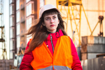 Female construction worker against gas separation plant