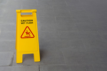 yellow wet sign floor on floor
