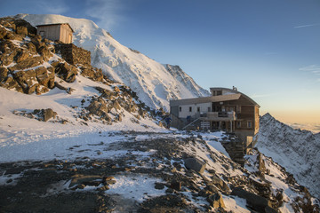 Tete Rousse refuge at sunset in the French Alps