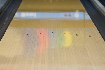 black arrow sign on bowling alley background