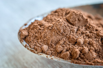 Cocoa powder spoonful. Macro view.