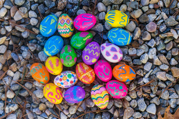 Fototapeta na wymiar Collorfull easter eggs on gravel