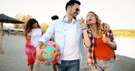 Fototapeta premium Group of young cheerful people bonding to each other and smiling