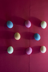 Colorful eggs on a red backround
