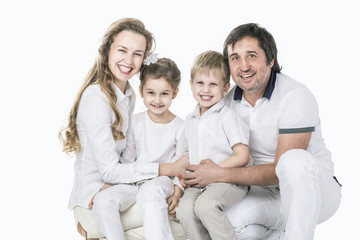 Fototapeta na wymiar family portrait: parents with daughter and son on white background