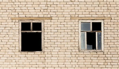 Obraz na płótnie Canvas Windows in a brick house under construction
