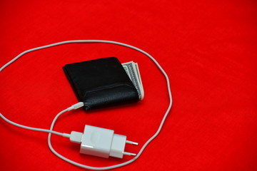 Black purse charged from the network on a red background