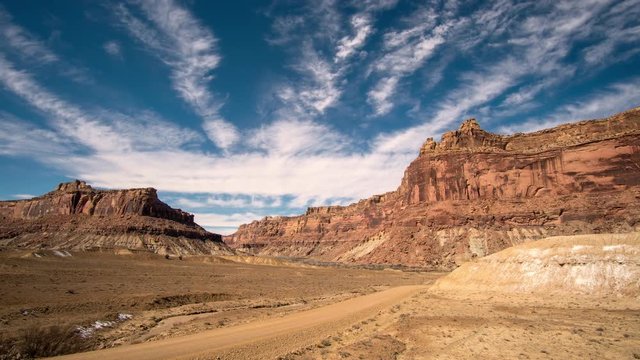 Time lapse in Buckhorn Draw in the San Rafael Swell with road through the desert in Utah.