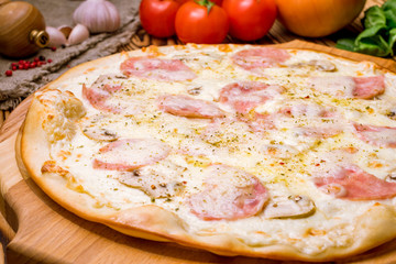 Pizza with ham and mushrooms