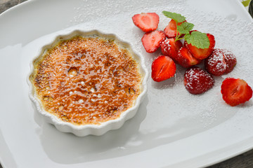 Creme brule with licorice and strawberries