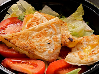 Freshly made Cheese Quesadillas bowl studio photo