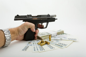 gun and czech banknotes, crime concept