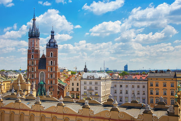 Naklejka na ściany i meble .View of the mariacki church and the roof of the building sukiennice from the height of the town hall building in the Polish city of Krakow.