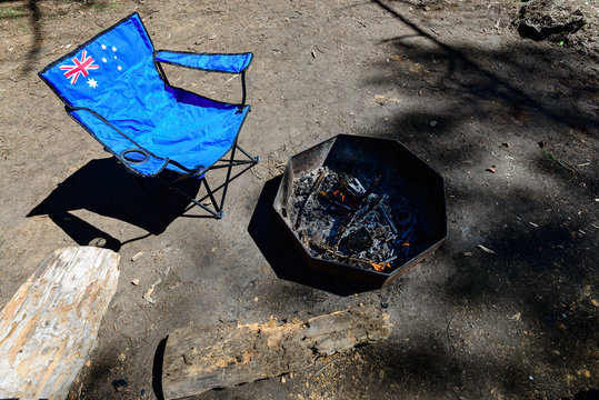Portable chair with flag of Australia standing near fire place - Powered by Adobe