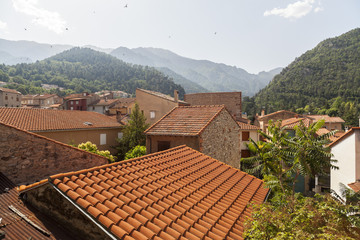 Obraz premium Village houses and mountain view. Vernet-les-Bains, pyrenees village, spa and thermal touristic destination.France.