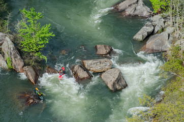 Two Kayaks in Rapids