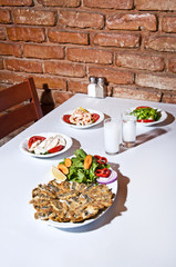 Fish, appetizer and Turkish raki from Turkish tavern