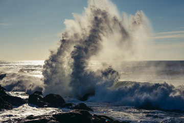 Fototapeta na wymiar Spectacular wave crash seen from beach in Porto city, Portugal