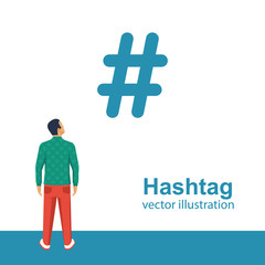 Hashtag concept. Promotion of social networks. Description tags. Social media. Young man looks at hashtag. Vector illustration flat design. Isolated on white background.